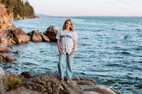 Young woman at the beach with baseball jersey