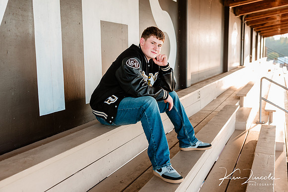 Young athlete in letterman jacket